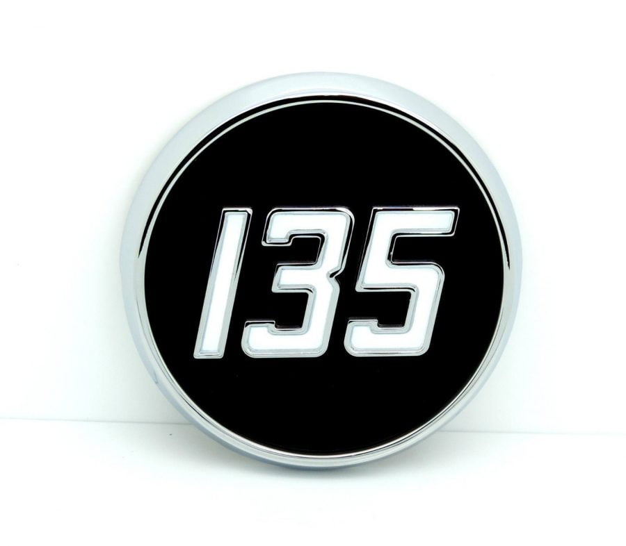 DIECAST CHROME SIDE BADGE FOR MASSEY FERGUSON 135 TRACTORS.